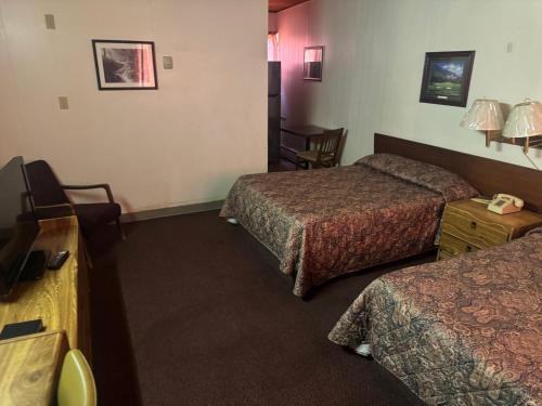 Postel nebo postele na pokoji v ubytování Big Horn motor Inn