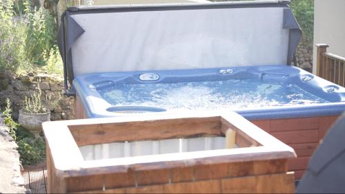 a hot tub sitting on top of a patio at The Almanage in Clogheen