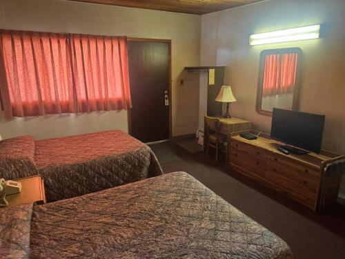 Postel nebo postele na pokoji v ubytování Big Horn motor Inn