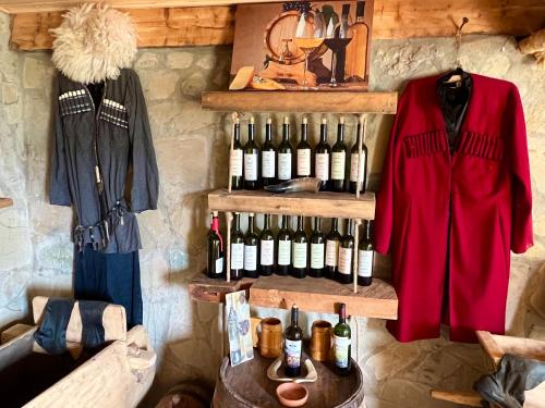 a room with a bunch of bottles of wine at Gentry House in Ambrolauri