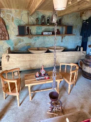 a room with two chairs and a swing at Gentry House in Ambrolauri