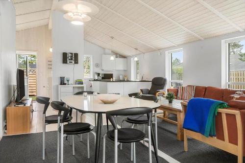 a kitchen and living room with a table and chairs at SL328-Slagelse-Egebaekvej-21 in Slagelse