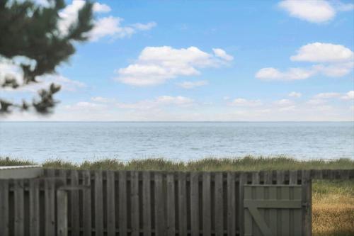 a wooden fence in front of the ocean at SL328-Slagelse-Egebaekvej-21 in Slagelse