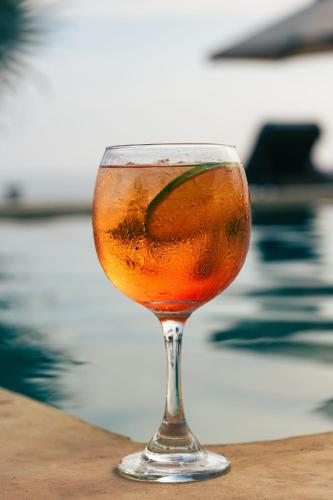 a drink in a glass sitting on a table at Casa Yuma, Puerto Escondido in Puerto Escondido