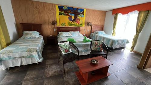 Ein Bett oder Betten in einem Zimmer der Unterkunft Hostal Harepakoba