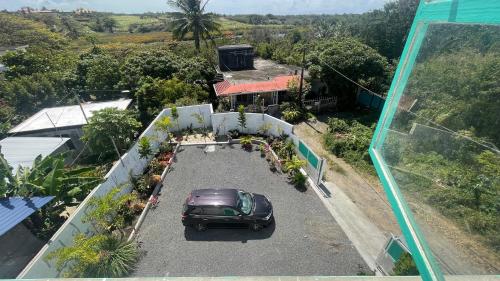 an overhead view of a car parked in a parking lot at Le Maho AHAVAH in Trou dʼ Eau Douce