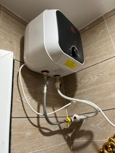a hair dryer is attached to a wall at RYN Apartment 1 in Sabo