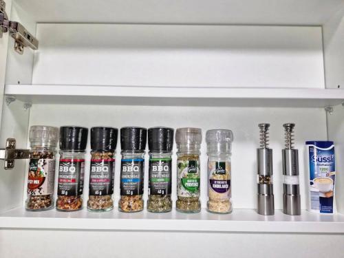 a shelf with a bunch of spices in a refrigerator at Feriendomizil 219 in Allerheiligen bei Wildon