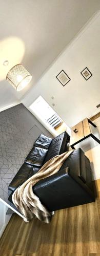 a bedroom with a bed with a blanket on it at Newly refurbished near Windsor Maidenhead and Reading 20 minutes train to London with parking in Slough