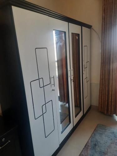 a room with sliding glass doors in a room at ستوديو فرش فندقي برج تاور سي in Ajman 