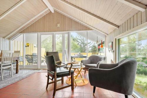 a living room with chairs and a table at K19007-Kalundborg-Strandskraenten-11 in Kalundborg