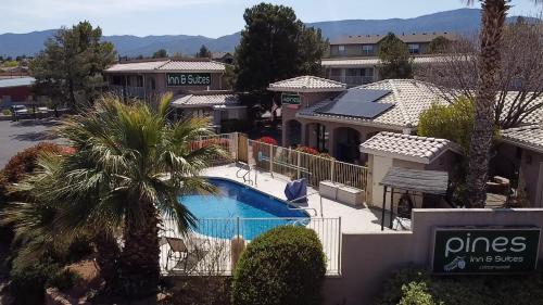 arial view of a resort with a swimming pool at Pines Inn & Suites in Cottonwood