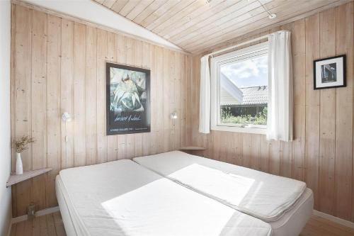 a bedroom with a white bed and a window at SL051-Slagelse-Dansvej-10 in Slagelse