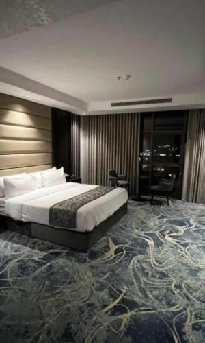 Ένα ή περισσότερα κρεβάτια σε δωμάτιο στο demashotel
