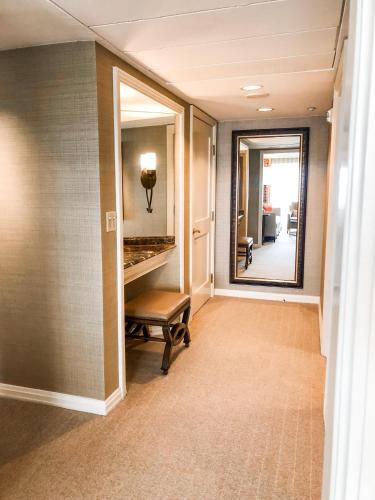 a hallway with a mirror and a bench in a hallway at The Westin Riverwalk, San Antonio in San Antonio