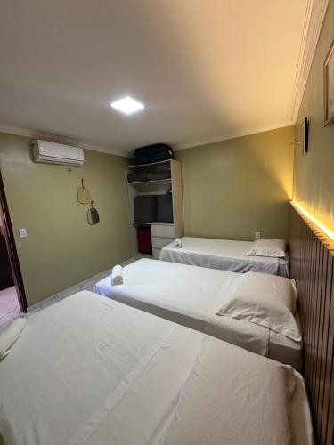 Ein Bett oder Betten in einem Zimmer der Unterkunft Residência Lugnier