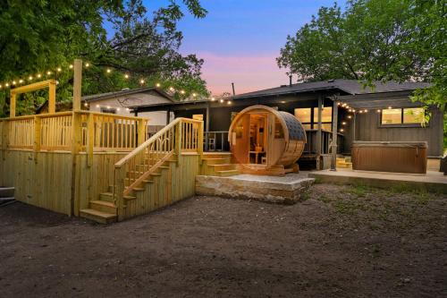 a home with a wooden fence and a wooden house at Upscale 4BR Residence Quick Access to Downtown in Austin