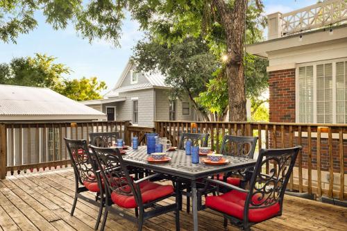 a black table and chairs on a wooden deck at Walk to Schlitterbahn & Downtown Sleeps 12 in New Braunfels