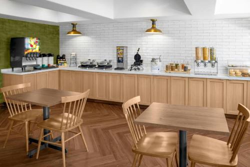 a restaurant with two tables and a counter at Fairfield Inn & Suites by Marriott San Francisco San Carlos in San Carlos