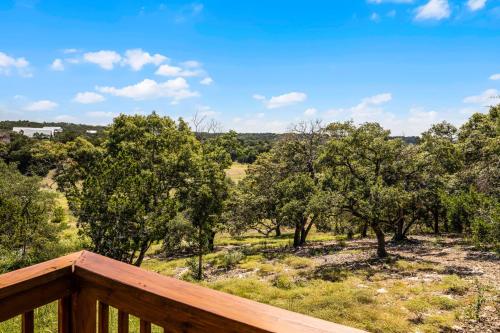 a view from the deck of a home with trees at Breathtaking Views Hilltop for Couples Firepit in Canyon Lake