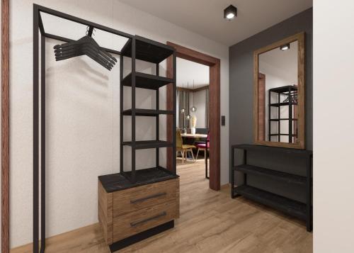 a room with a book shelf and a mirror at Astellina hotel-apart in Ischgl