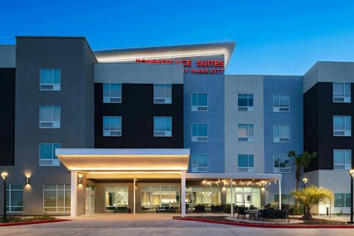 a rendering of the front of a hotel with a building at TownePlace Suites Brownsville in Brownsville