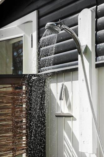 a shower on the side of a house at 20399-Samso-Laerkevej-24 in Nordby