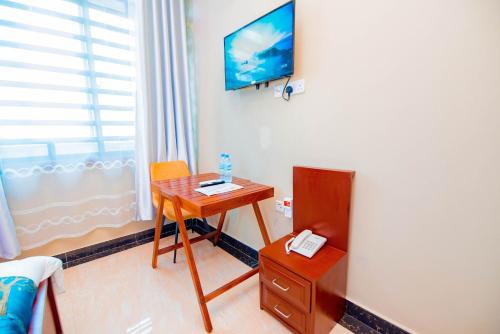 TV a/nebo společenská místnost v ubytování HBE HOTEL Kigamboni
