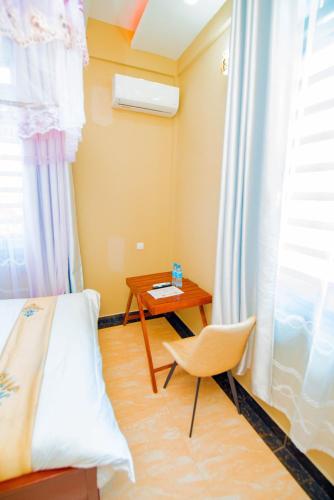 Postel nebo postele na pokoji v ubytování HBE HOTEL Kigamboni