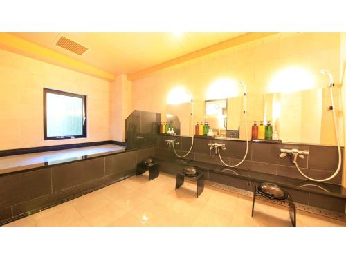 a large bathroom with two sinks and two mirrors at Smile Hotel Kawaguchi - Vacation STAY 05011v in Kawaguchi