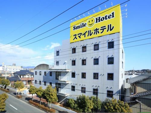 a large white building with a sign on it at Smile Hotel Kakegawa - Vacation STAY 77614v in Kakegawa