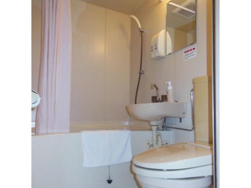 a bathroom with a toilet and a sink at Smile Hotel Kakegawa - Vacation STAY 77622v in Kakegawa
