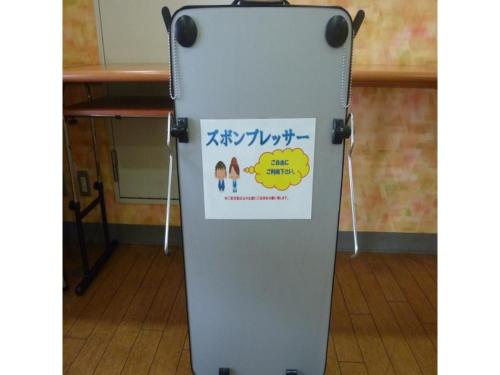 a metal refrigerator with a sign on it at Smile Hotel Kakegawa - Vacation STAY 77624v in Kakegawa
