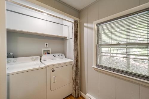 a laundry room with a washer and dryer and a window at 'Bear Crossing Chalet:' Beech Mountain Family Home in Beech Mountain