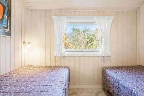 a bedroom with two beds and a window at SB110-Nordborg-Sostjerneparken-36 in Nordborg