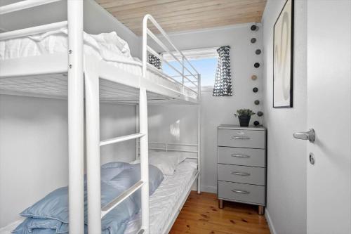 a bedroom with a bunk bed with a ladder at SB50628-Sydals-Egemose-131 in Skovmose