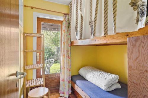 a bedroom with a bunk bed and a window at SB50626-Sydals-Egemose-157 in Skovmose