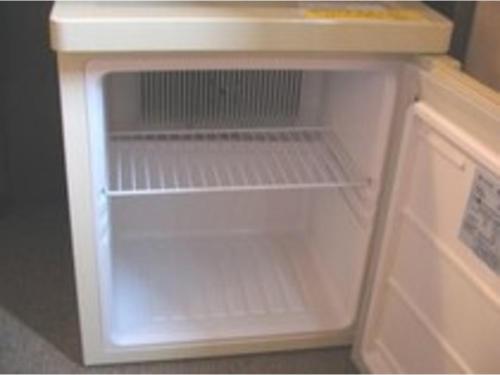 an empty refrigerator with its door open in a kitchen at Smile Hotel Mito - Vacation STAY 99817v in Mito