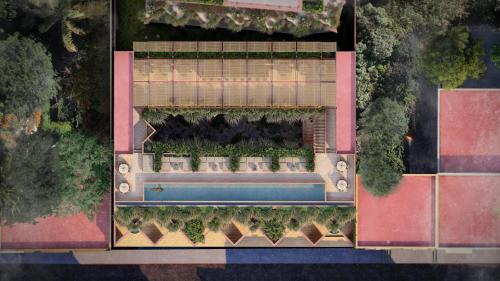 an overhead view of a swimming pool with plants at Laiva Hotel San Jose by Tasman in San José del Cabo