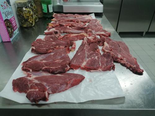 a line of cuts of meat on a counter at Colliano Hotel in Colliano