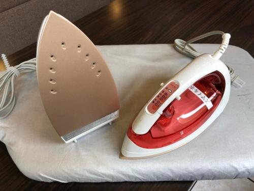 a red and white iron sitting on top of a napkin at Smile Hotel Mito - Vacation STAY 99823v in Mito