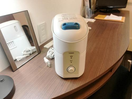 a hair dryer sitting on top of a counter at Smile Hotel Mito - Vacation STAY 99832v in Mito