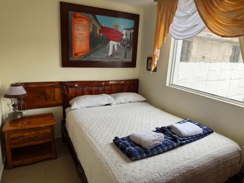 Postel nebo postele na pokoji v ubytování Hotel Maderanegra By Huasicama