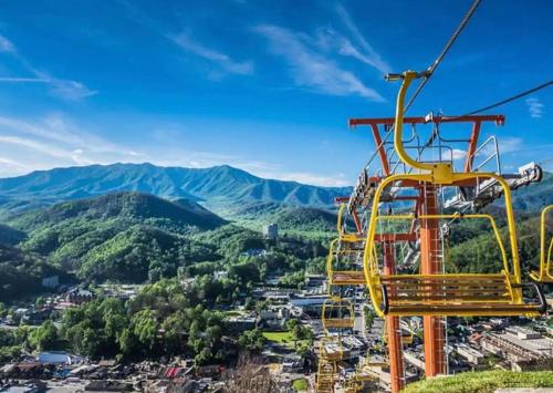 a gondola ride at the top of a mountain at Best Value Cabin Hot Tub Arcade Close to Strip in Pigeon Forge