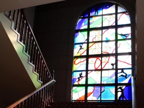 a stained glass window in a stair case at K,M,H Art hotel by Kure Morisawa - Vacation STAY 11396v in Kure