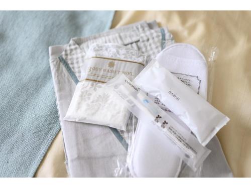 a pair of white shoes and a pair of socks at K,M,H Art hotel by Kure Morisawa - Vacation STAY 11396v in Kure