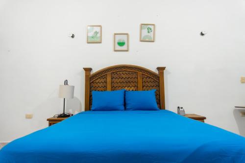 En eller flere senge i et værelse på Casa Elena