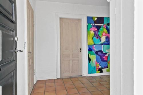 a room with a door with a colorful wall at TV1476-Skagen-Kirkevej-2 in Skagen