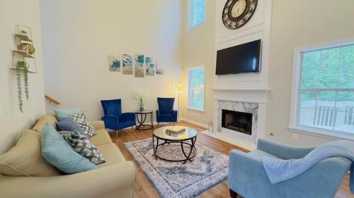 a living room with a couch and a fireplace at Dalby Way in Austell