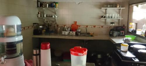 a kitchen with a counter top with a stove and a counter top at posada el encanto in Estación El Salto